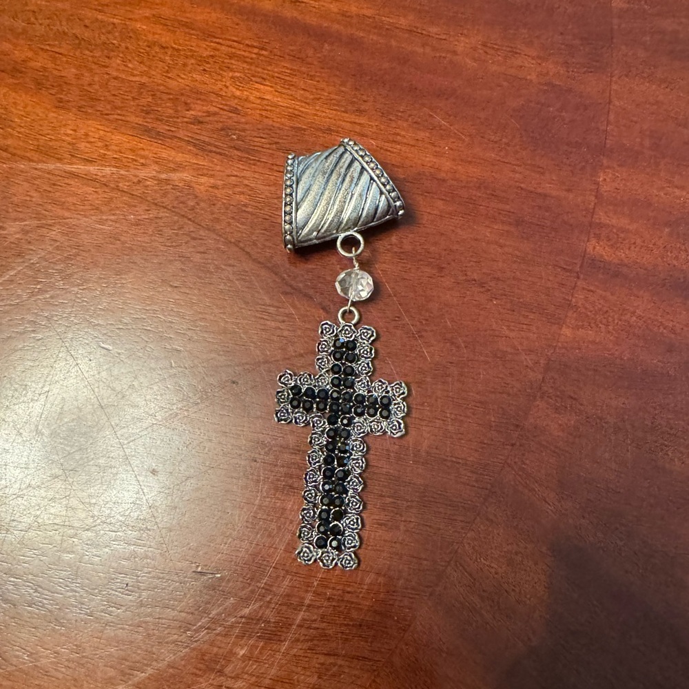Elegant Black and Silver Cross Pendant